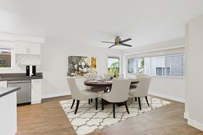 Newport Beach apartment for rent - A modern dining room with a table set for four.