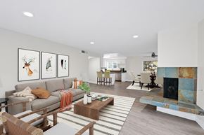 Newport Beach apartment for rent - A living room with a grey couch and a coffee table.