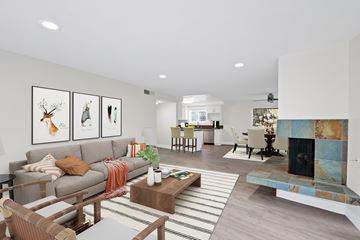 Newport Beach apartment for rent - A living room with a grey couch and a coffee table.