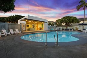 Newport Beach apartment for rent - A pool with a building behind it.