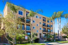 Los Angeles apartment for rent - A building with a red and white sign in front of it.