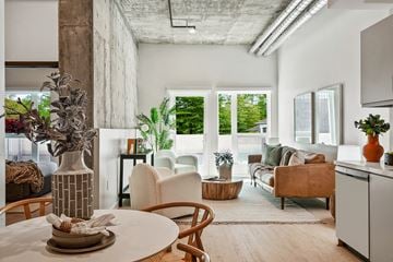 Los Angeles apartment for rent - A modern living room with a dining table and chairs.