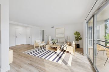 Sherman Oaks apartment for rent - A living room with a white couch and a coffee table.