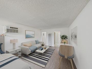 Arleta apartment for rent - A living room with a grey couch and a striped rug.