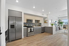 Bellflower apartment for rent - a modern kitchen with stainless steel appliances and a wooden floor