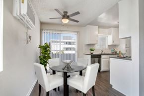 Los Angeles apartment for rent - A dining room with a glass table and white chairs.