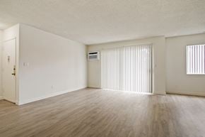 Los Angeles apartment for rent - A room with wooden flooring and a window with blinds.