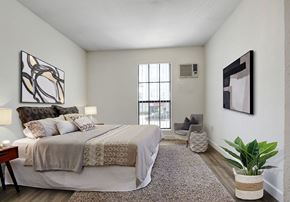 North Hollywood apartment for rent - a bedroom with a large bed and a large window