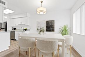 Los Angeles apartment for rent - a dining room with a white table and chairs