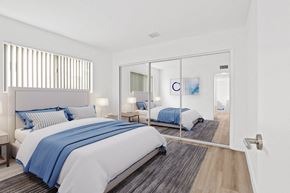 Los Angeles apartment for rent - a bedroom with two beds and a sliding glass door