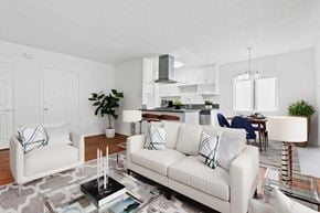Beverly Hills apartment for rent - a living room with white couches and a glass coffee table