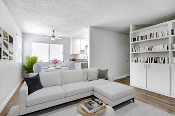 Northridge apartment for rent - A living room with a white couch and a coffee table.