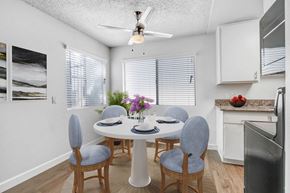 Northridge apartment for rent - a dining room with a table and chairs and a ceiling fan