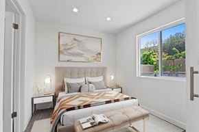 Tarzana apartment for rent - a bedroom with a bed and a large window