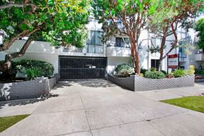 Los Angeles apartment for rent - a gated driveway in front of an apartment building