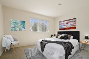 Valley Village apartment for rent - A bedroom with a large bed and a painting on the wall.