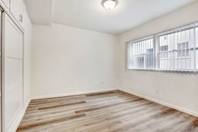 Los Angeles apartment for rent - a bedroom with hardwood floors and a large window