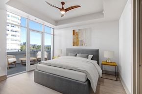 Los Angeles apartment for rent - a bedroom with a bed and a ceiling fan