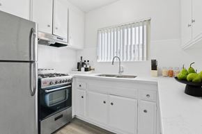 Los Angeles apartment for rent - a white kitchen with stainless steel appliances and white cabinets
