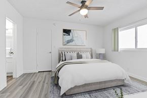 Los Angeles apartment for rent - a bedroom with a large bed and a ceiling fan
