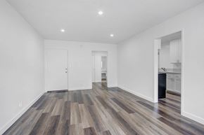 Van Nuys apartment for rent - a living room with white walls and wood floors