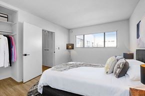 Studio City apartment for rent - A bedroom with a bed, a wardrobe, and a window.