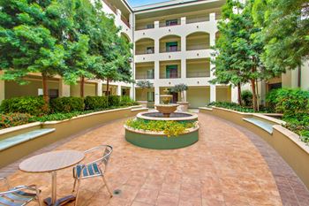 Professionally landscaped courtyards with fountains & tranquil seating areas