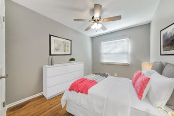 Marina Del Rey apartment for rent - A bedroom with a white bed and a ceiling fan.