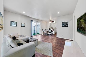 Mission Hills apartment for rent - A living room with a white couch and a rug.