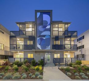 Los Angeles apartment for rent - Modern apartment facade with illuminated units at twilight at Cypress Co-Living Apartments, Los Angeles, 90024