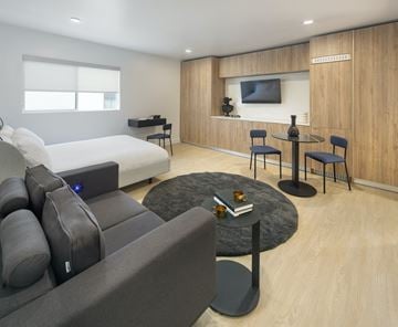 Los Angeles apartment for rent - A modern living room with a grey sofa and a black coffee table.