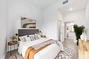 Los Angeles apartment for rent - a white bedroom with a large bed and a bathroom