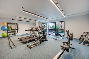 Los Angeles apartment for rent - a gym with treadmills and other exercise equipment in a building with windows
