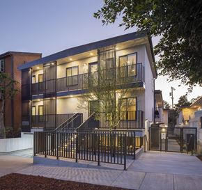 Los Angeles apartment for rent - the facade of a building with stairs and a gate