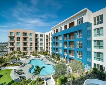 Lushly landscaped pool terrace with spa, fireside lounging, private cabanas and grilling areas