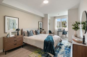 Hard surface flooring throughout living room, kitchen, and bedrooms