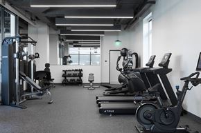 Los Angeles apartment for rent - A gym with a variety of equipment including treadmills, weights, and exercise machines at Skylar At Sunset Apartments, California, 90027