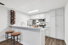 Los Angeles apartment for rent - A kitchen with white cabinets and a white counter top.