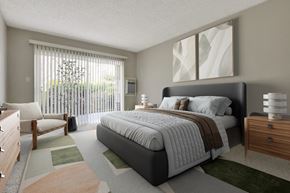 Los Angeles apartment for rent - A bedroom with a large bed and a chair by the window.