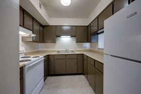 Bowling Green apartment for rent - Kitchen with all white appliances and ample cabinets in a 3 bedroom apartment at Regency Park Apartments