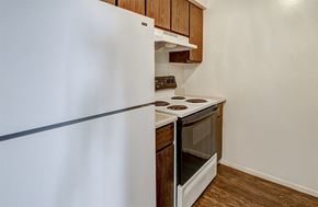 Indianapolis apartment for rent - Apartment Kitchen at The Woods of Eagle Creek with white appliances