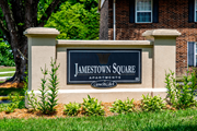 Vincennes apartment for rent - A sign that says Jamestown Square in front of a brick building.