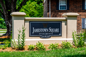 Vincennes apartment for rent - A sign that says Jamestown Square in front of a brick building.