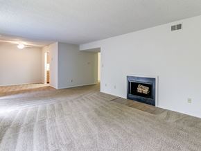 Evansville apartment for rent - Living space at Ashley Pointe Apartments with a wood burning fireplace