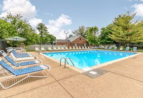 Evansville apartment for rent - Outdoor swimming pool with seating at Ashley Pointe Apartments