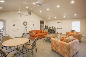 Indianapolis apartment for rent - a living room with couches and chairs and a table