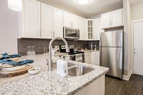 Indianapolis apartment for rent - Marble Style Floorplan Kitchen at Quarry at River North Apartments, Indiana 46240