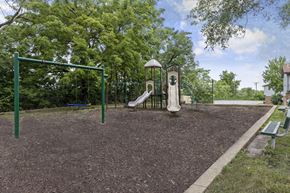 Florissant apartment for rent - Playground with swing sets, slides and climbing equipment at Stonebridge Townhomes