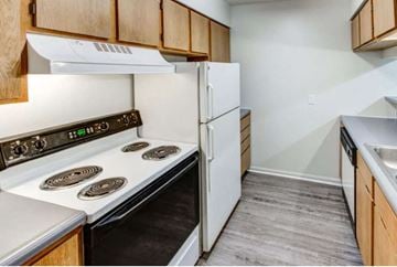 Michigan City apartment for rent - a kitchen with a stove and a refrigerator