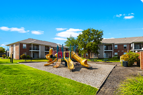 Brownsburg apartment for rent - Playground at Brownsburg Pointe Apartments with colorful play structures and open play area.